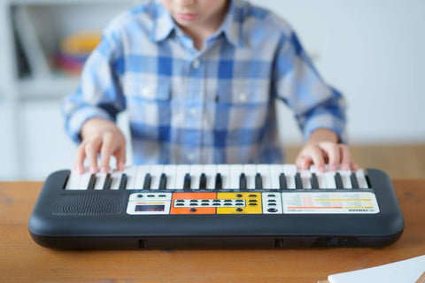 Child playing a Keyboard
